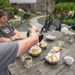 Three men enjoying afternoon tea at turnip cottage in the Mourne Mountains